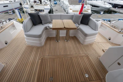 Luxurious 2026 Princess F65 yacht deck with elegant seating and wooden flooring.