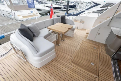 Luxurious 2026 Princess F65 yacht deck with elegant seating and wooden flooring.