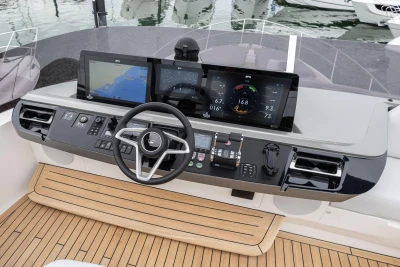 Helm of 2026 Princess F65 yacht with advanced navigation displays and controls.