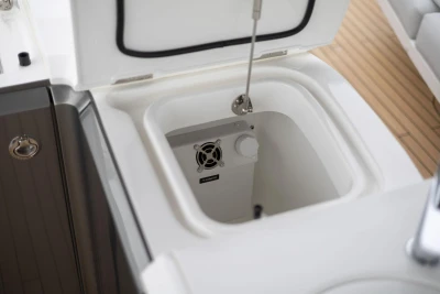 Open storage compartment on 2026 Princess F65 yacht with built-in ventilation.
