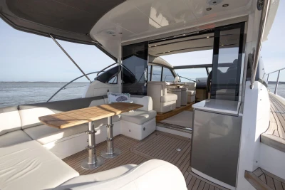 Luxurious 2018 Princess V50 yacht interior with elegant seating and ocean view.