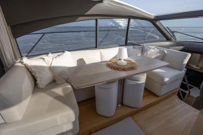 Luxurious interior of 2018 Princess V50 yacht with elegant seating and ocean view.