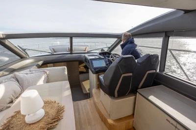 Interior view of 2018 Princess V50 yacht with modern helm and seating area.