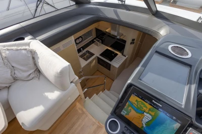 Luxurious interior of 2018 Princess V50 yacht with modern kitchen and navigation system.