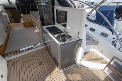 Luxurious 2018 Princess V50 yacht interior with sleek kitchenette and modern design.
