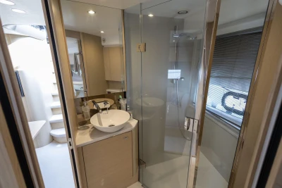 Luxurious bathroom in 2018 Princess V50 yacht with modern fixtures and glass shower.