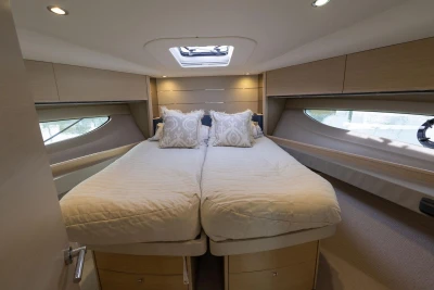 Luxurious 2018 Princess V50 yacht bedroom with elegant bedding and modern design.