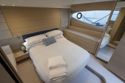 Luxurious bedroom interior of 2018 Princess V50 yacht with modern design and elegant furnishings.