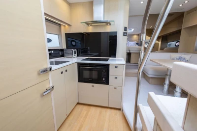 Modern kitchen interior of 2018 Princess V50 yacht with sleek cabinetry and appliances.