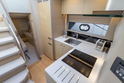 Modern kitchen interior of 2018 Princess V50 yacht with sleek appliances and cabinetry.