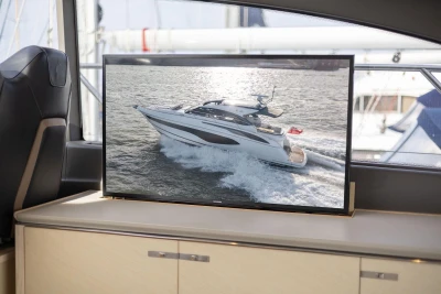 Television displaying a 2018 Princess V50 yacht cruising on the water.