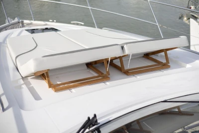 Sun loungers on 2018 Princess V50 yacht deck, featuring sleek design and comfortable seating.