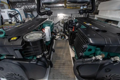 Engine room of a 2018 Princess V50 yacht, showcasing dual engines and mechanical components.