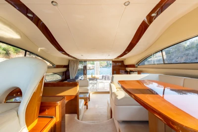 Luxurious interior of a 2008 Princess 58 yacht with elegant wood finishes.