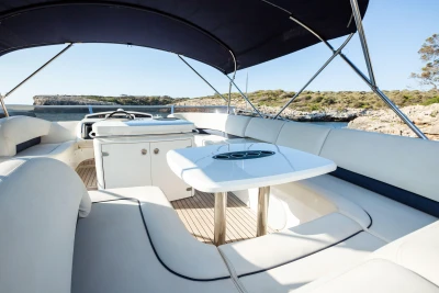 Luxury yacht interior with seating and table, Princess 58 model, 2008, scenic coastal view.