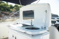 Outdoor kitchen on a 2008 Princess 58 yacht with sink and grill.