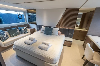 Luxurious bedroom interior of 2021 Princess Y72 yacht with modern design and elegant furnishings.