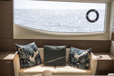 Luxurious interior of 2021 Princess Y72 yacht with ocean view through large window.
