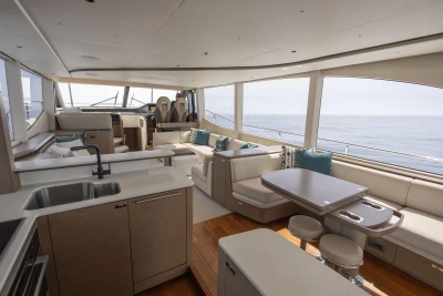 Luxurious interior of 2021 Princess Y72 yacht with modern seating and ocean view.