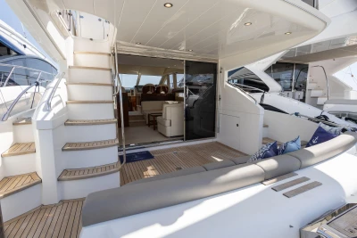 Luxurious 2010 Princess 50 yacht interior with elegant seating and wooden deck.
