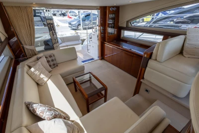 Luxurious interior of a 2010 Princess 50 yacht with elegant seating and modern decor.