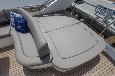 Luxurious seating area on a 2010 Princess 50 yacht with cushions and pillows.