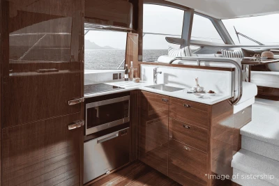 Luxurious kitchen interior of 2026 Princess F50 yacht with modern appliances and ocean view.