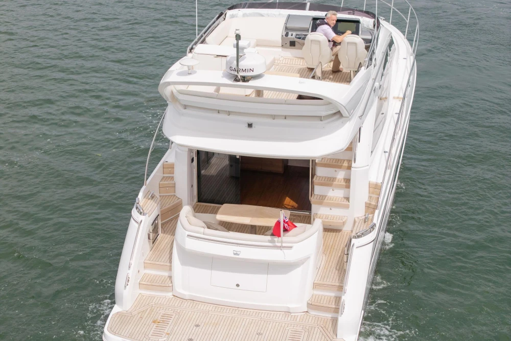 Luxurious 2026 Princess F50 yacht cruising on open water, featuring elegant design and spacious deck.