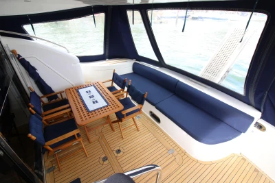 Luxurious 2004 Princess 61 yacht deck with seating area.