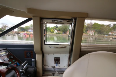 Interior of a 2004 Princess 61 yacht with water view.