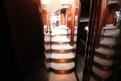 Luxurious staircase in a 2004 Princess 61 yacht.