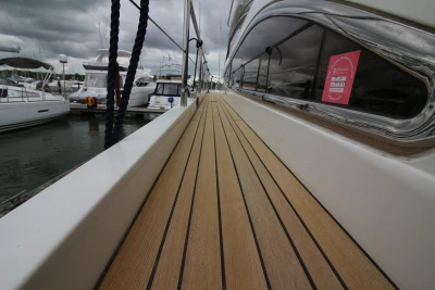 Teak deck of a 2004 Princess 61 yacht in harbor.