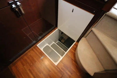 Hidden compartment in the floor of a 2004 Princess 61 yacht.