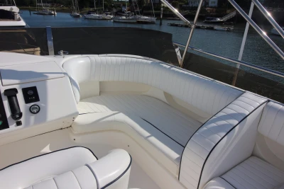 Luxurious white seating on a 2004 Princess 61 yacht.