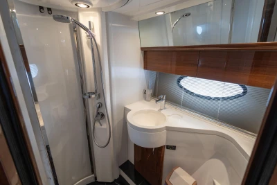 Luxurious bathroom in 2013 Princess 42 yacht with modern fixtures and elegant design.