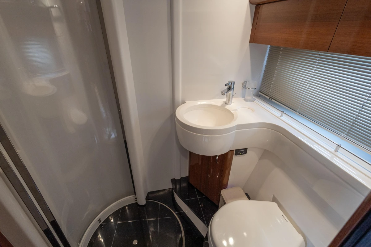 Luxurious bathroom in 2013 Princess 42 yacht with modern fixtures and elegant design.