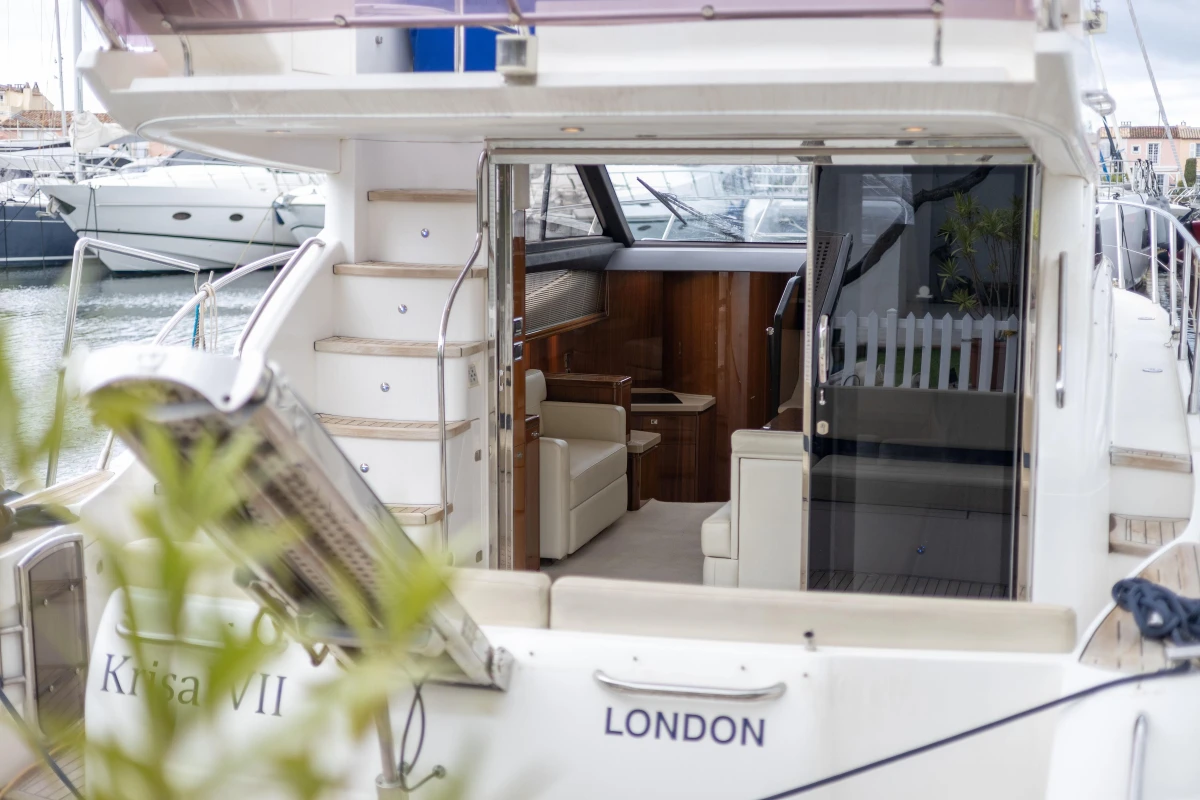 Luxury yacht Princess 42, 2013 model, docked with open cabin view, London registration.