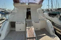 Luxury Princess 42 yacht, 2013 model, docked at marina with elegant design.