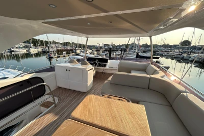 Luxurious 2020 Princess F55 yacht interior with spacious seating and marina view.