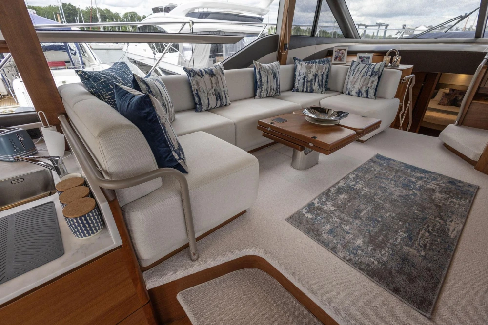 Luxurious interior of 2020 Princess F55 yacht with elegant seating and decor.