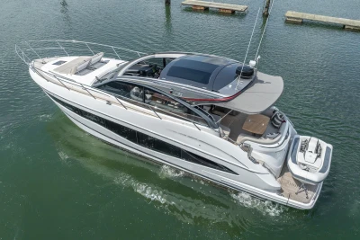 2023 Princess V50 yacht cruising on calm waters, showcasing sleek design and luxury features.