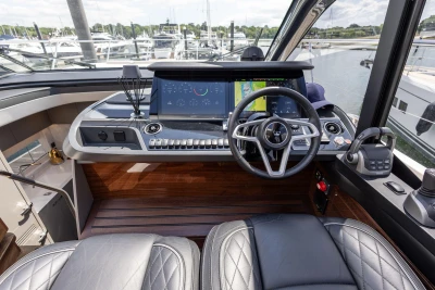 Cockpit of 2023 Princess V50 yacht with modern controls and leather seating.