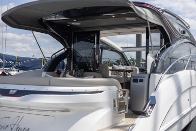 2023 Princess V50 yacht with sleek design and luxurious interior at a marina.