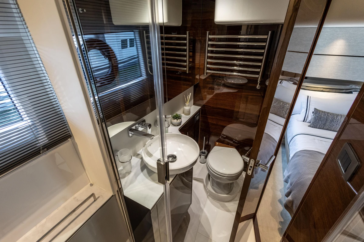 Luxurious bathroom in 2023 Princess V50 yacht, featuring modern fixtures and elegant design.