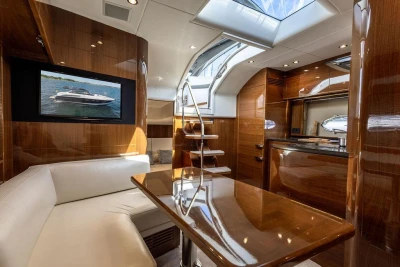 Luxurious interior of 2015 Princess V48 Open yacht with elegant wood finishes and modern amenities.