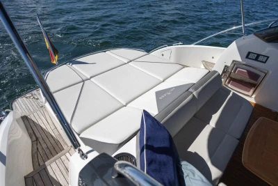 2015 Princess V48 Open yacht with sunbed and ocean view.