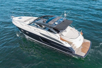 2015 Princess V48 Open yacht cruising on open water.