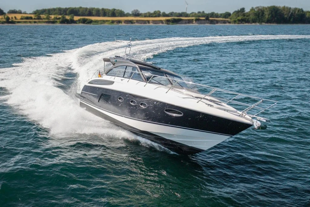2015 Princess V48 Open yacht cruising on open water.