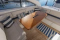 Luxurious 2006 Princess V53 yacht interior with elegant seating and wooden table.