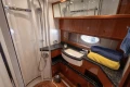 Luxurious bathroom in 2006 Princess V53 yacht with modern fixtures and elegant wood finishes.